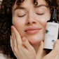 Laponie Nourishing Oil Cleanser held by model